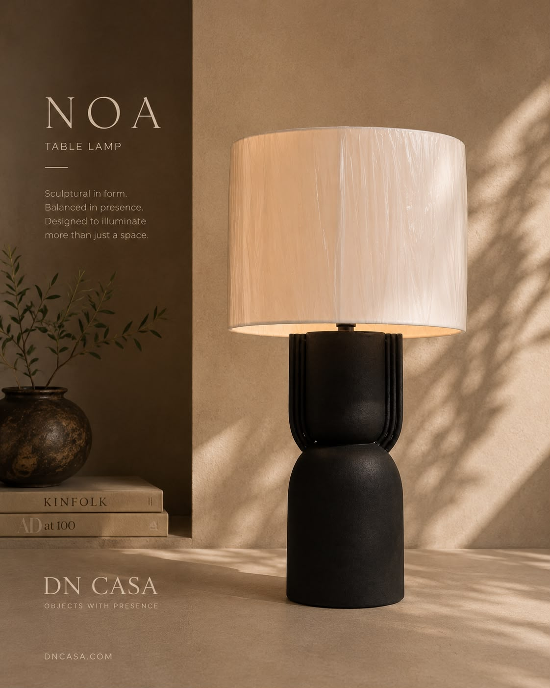 NOA black table lamp styled in warm light